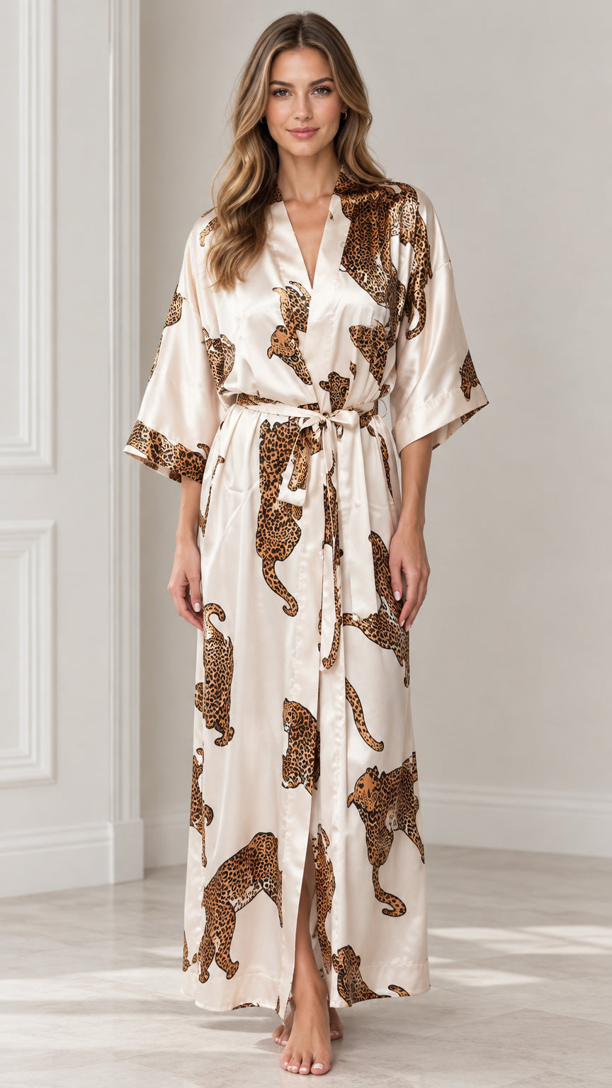 Full-length front view of model wearing champagne leopard print satin maxi kimono robe with belt