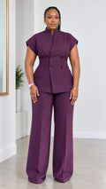Front full-length view of woman wearing plum stand collar double-breasted top and wide-leg pant suit set