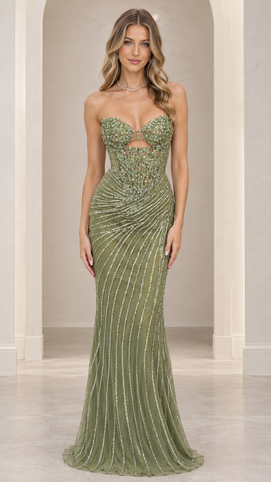 Front view of model wearing sage green strapless beaded corset evening gown with front cutout