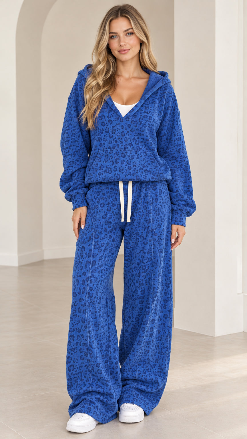 Front full-length view of woman wearing Royal Blue leopard print hooded top and wide leg lounge pants set