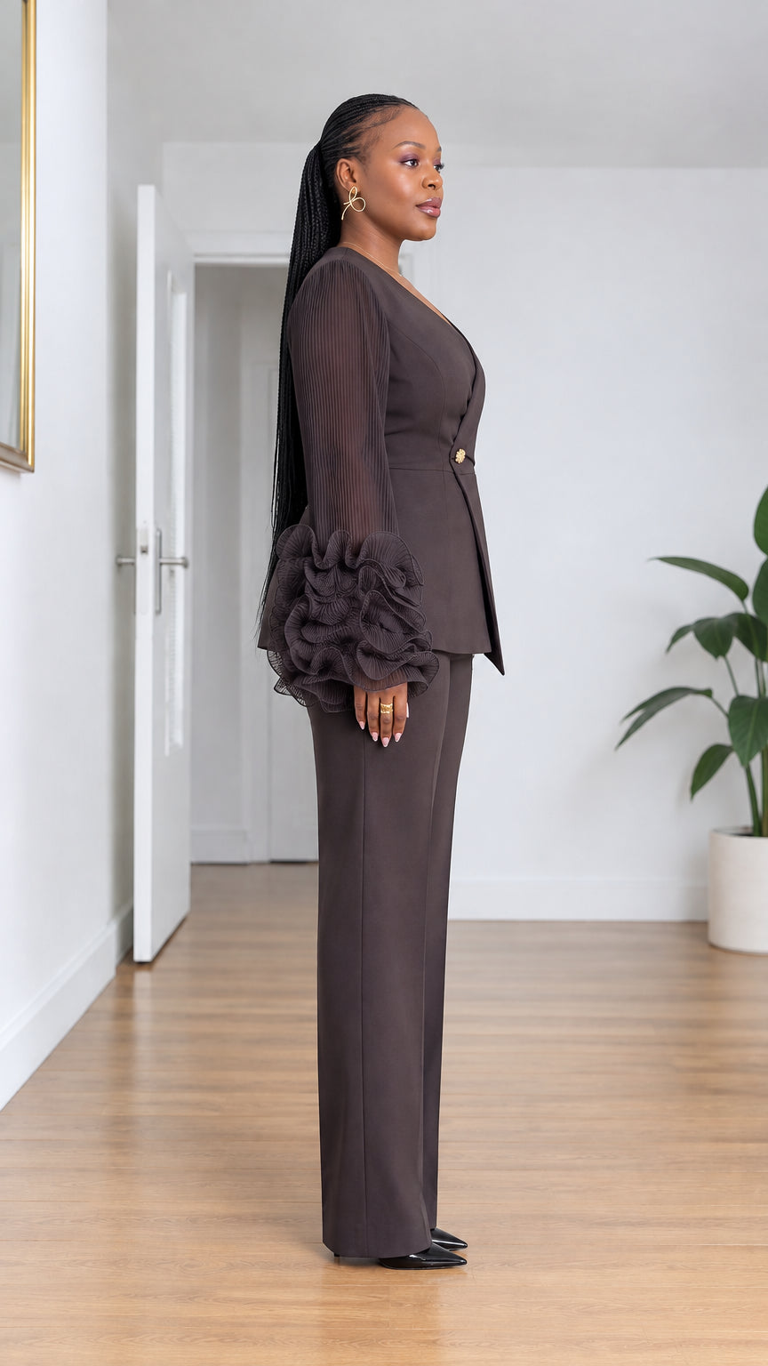 Side profile view of model wearing Chocolate Brown pant suit showing tiered ruffle cuff details