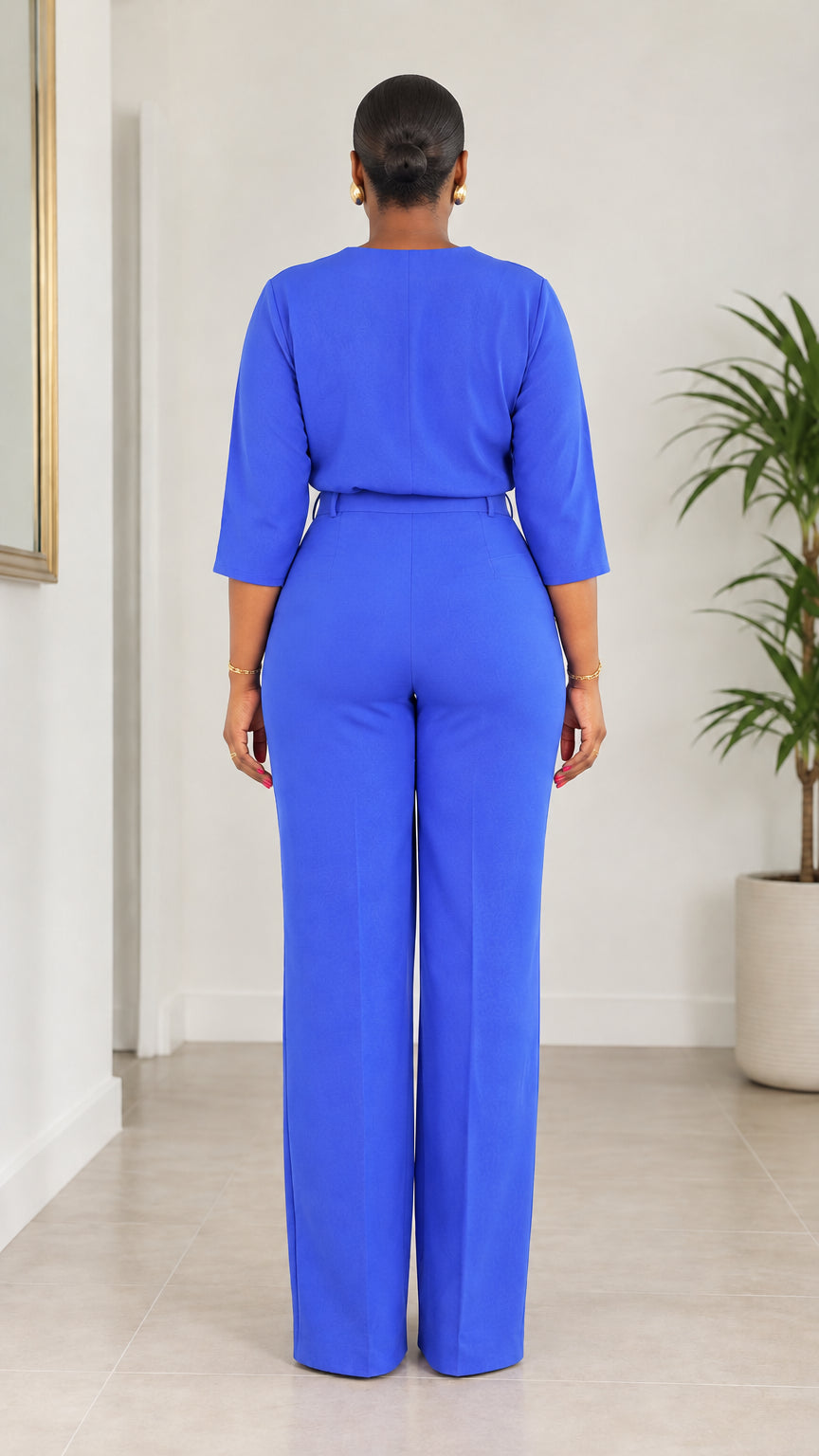 Back view of woman wearing Royal Blue two-piece blouse and trouser set