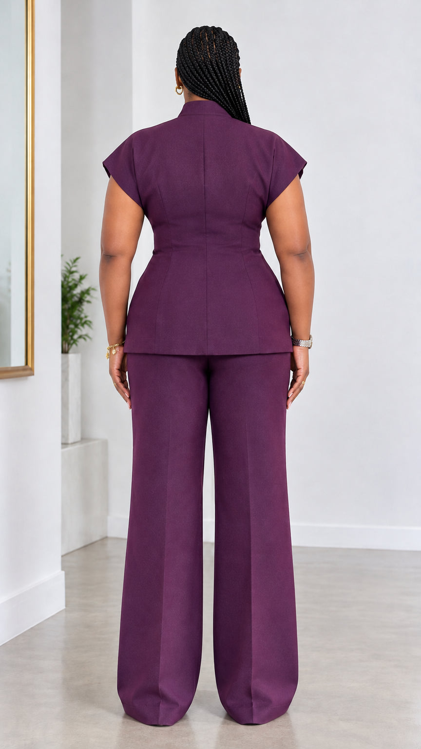 Back full-length view of woman wearing plum tailored two-piece suit set