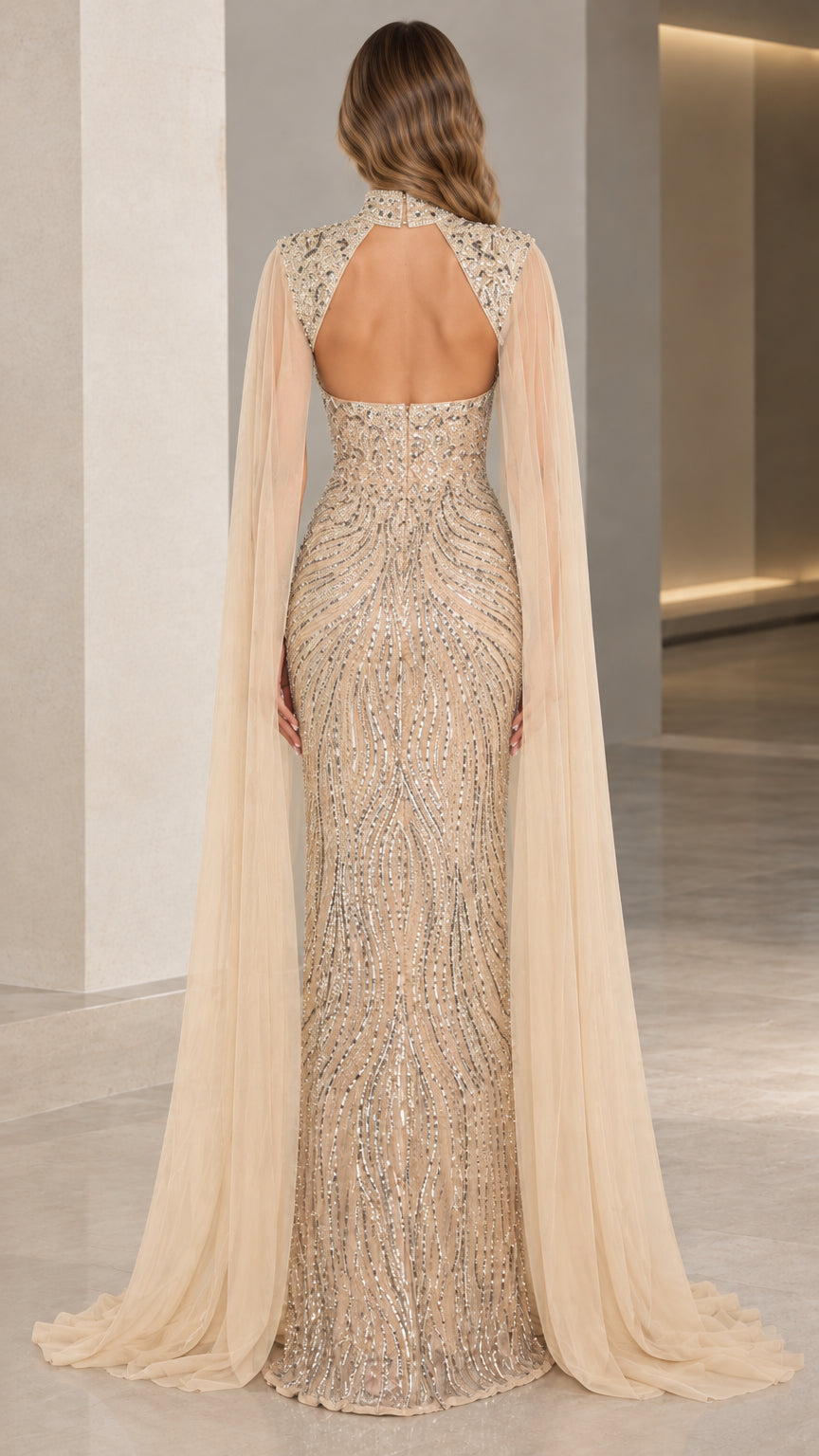 Back view of champagne sequin gown showing open keyhole cutout and sweeping train