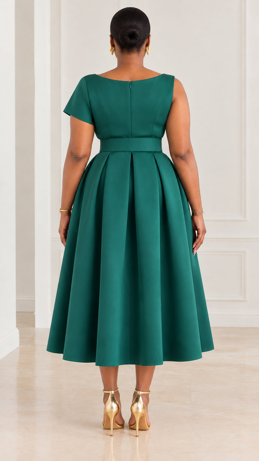 Back view of emerald green belted midi dress showing back neckline and pleated skirt