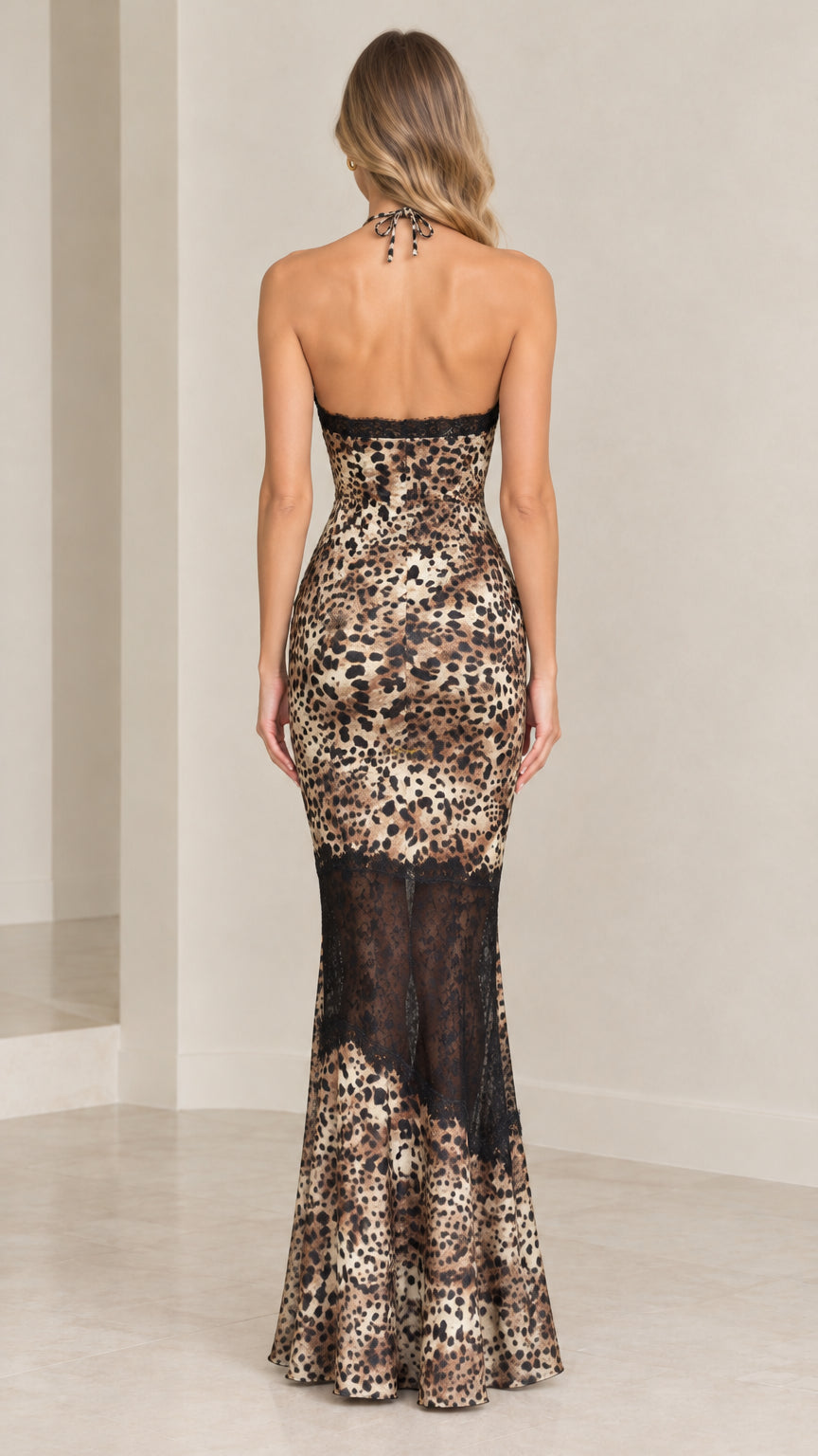 Back view of brown leopard print halter dress highlighting backless design and tie neck