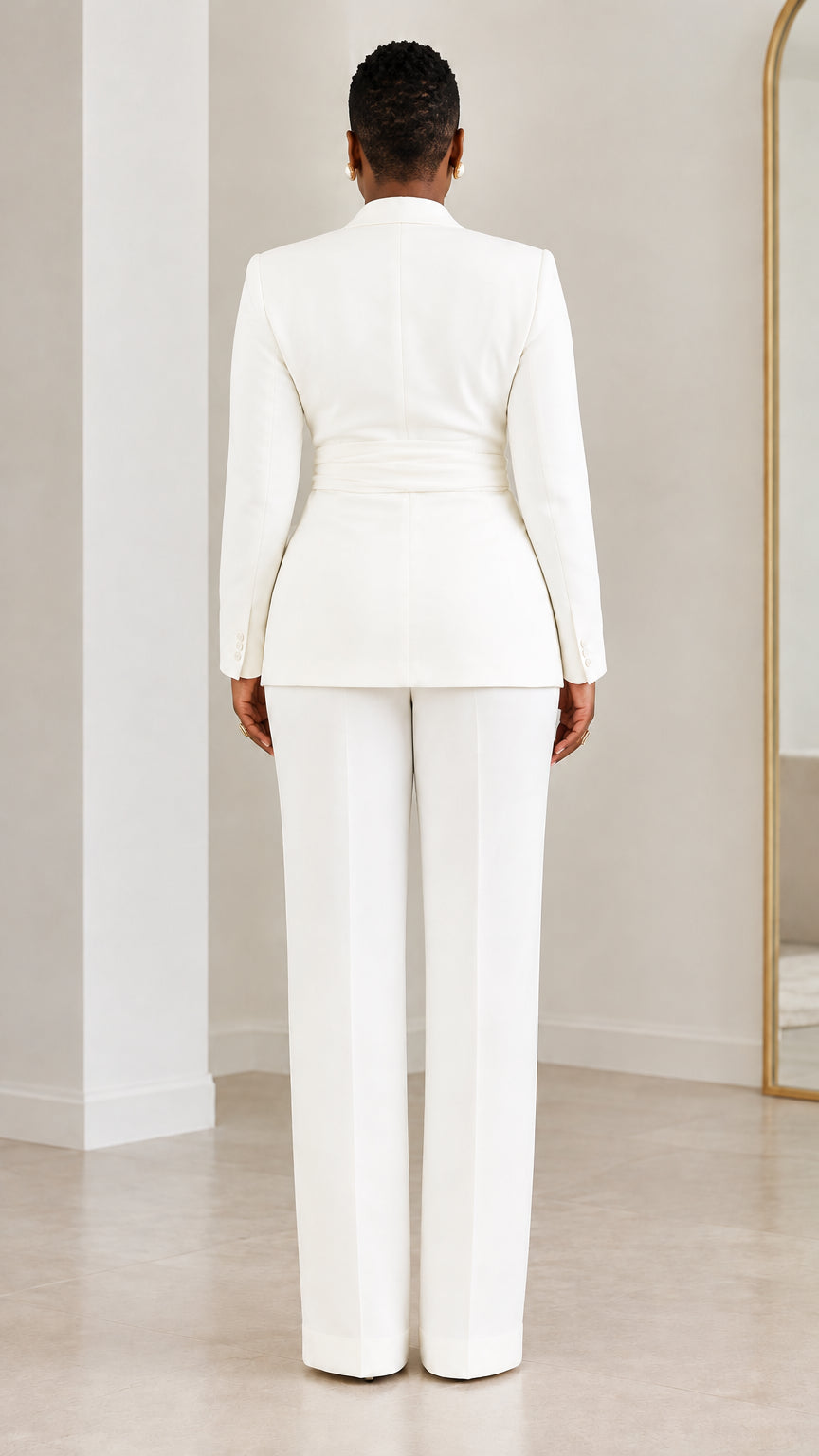 Back view of model wearing white wrap blazer and matching trousers