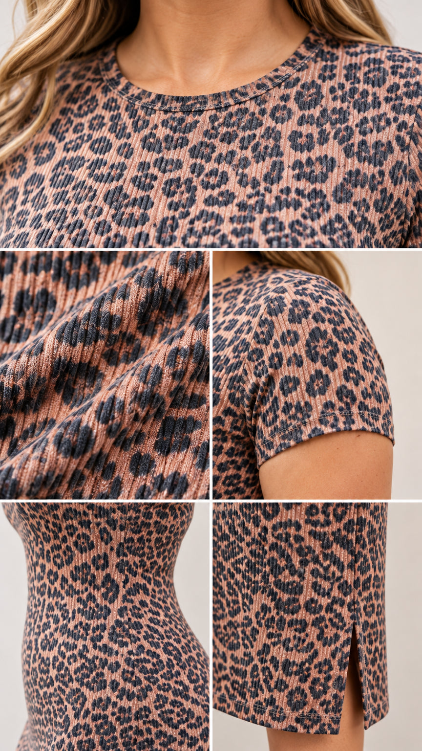 Close-up details of ribbed texture, crew neckline, short sleeve, and hem slit