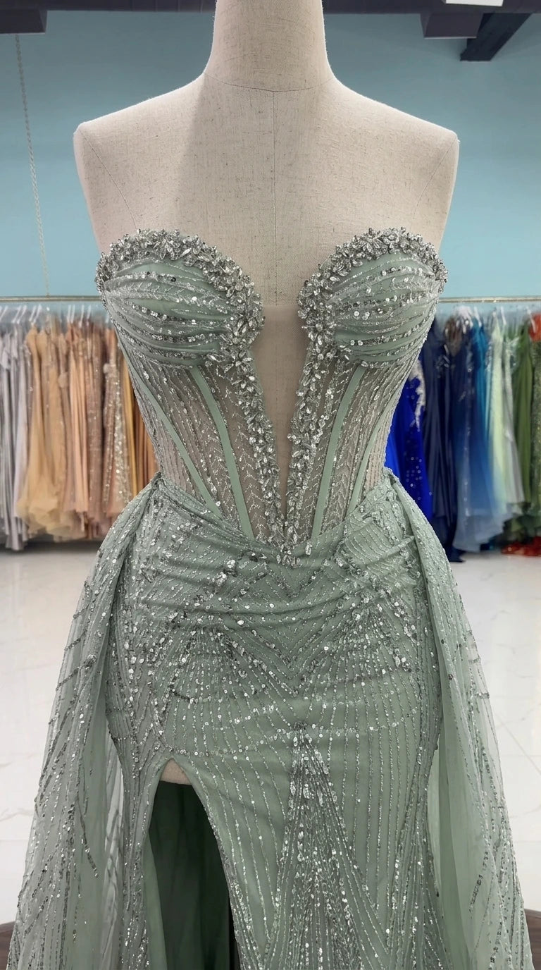 Close-up detail of mannequin wearing sage green sheer boned corset bodice with beading and sequins