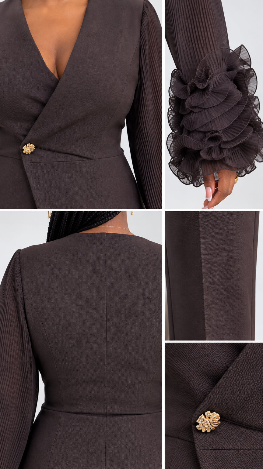 Close-up details of V-neckline, gold accent button, pleated ruffle cuffs, and trouser fabric in Chocolate Brown
