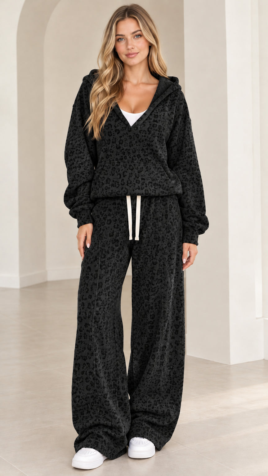 Front full-length view of woman wearing Black leopard print hooded lounge set