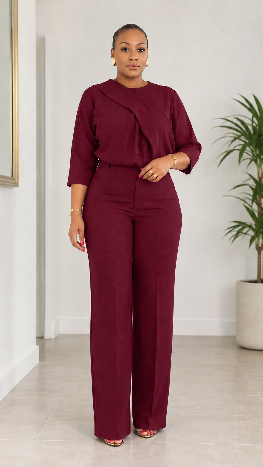 Front view of woman wearing Burgundy asymmetrical draped blouse and pant set